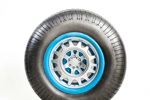 Introduction: Why Knowing How to Change a Tire is Essential
Flat tires are one of the most common roadside emergencies, affecting millions of drivers annually. Whether due to a puncture, blowout, or wear, being stranded without the ability to change a tire can be frustrating, dangerous, and costly. Learning how to change a car tire empowers you to handle the situation safely and quickly, potentially saving time and money on towing fees. This skill is crucial for all drivers, especially in remote areas or during bad weather.
In this comprehensive guide, we'll walk you through the entire process, from preparation to completion. We'll cover tools needed, safety tips, step-by-step instructions, and troubleshooting. With practice, you can change a tire in 15-30 minutes. Remember, while this guide is for standard vehicles, consult your owner's manual for model-specific details. Always prioritize safety— if you're unsure or conditions are hazardous, call for professional help.
Tools and Materials You'll Need
Before starting, gather the right equipment. Most cars come with a basic kit, but double-check yours. Essential items include:
Spare Tire: Ensure it's properly inflated (check pressure with a gauge).
Jack: The scissor or hydraulic type from your trunk.
Lug Wrench (Tire Iron): For loosening and tightening lug nuts.
Wheel Wedges or Blocks: To prevent the car from rolling (bricks or rocks work in a pinch).
Flashlight: For visibility at night.
Gloves and Reflective Triangle: For safety and signaling.
Optional Extras: Tire pressure gauge, sealant kit for minor punctures, and a lug nut key if your car has locking nuts.
Store these in your trunk for easy access. If your car lacks a spare (e.g., some modern models), consider a roadside assistance plan.
Safety Precautions Before You Begin
Changing a tire involves risks like vehicle instability or traffic hazards. Follow these precautions:
Park Safely: Pull over on a flat, stable surface away from traffic. Turn on hazard lights and set up flares or a reflective triangle 100 feet behind your car.
Engage Parking Brake: And chock the wheels not being lifted (front wheels if changing a rear tire, and vice versa).
Avoid Slopes: Never jack up on an incline— the car could roll.
Check Conditions: Don't attempt in rain, snow, or high winds. If the tire blew out at high speed, the rim might be damaged.
Wear Protection: Gloves prevent cuts from sharp metal; reflective gear increases visibility.
No Smoking: Sparks from tools could ignite fuel vapors.
For Families: Keep children and pets inside the vehicle or at a safe distance.
If you're alone, call a friend or roadside service. Safety first—rushing can lead to accidents.
Step-by-Step Guide to Changing a Tire
Follow these steps carefully. Practice in a safe environment before an emergency.
Prepare the Vehicle:
Loosen lug nuts slightly (about 1/2 turn) while the tire is on the ground. Use the lug wrench counterclockwise—don't remove them yet.
Place wheel wedges behind the opposite wheels to secure the car.
Position the Jack:
Locate the jack points (marked on your car's frame, usually under the doors).
Place the jack securely under the designated spot. Ensure it's stable on firm ground.
Jack Up the Car:
Raise the vehicle slowly until the flat tire is 6 inches off the ground. Never get under the car while jacking.
Double-check stability before proceeding.
Remove the Flat Tire:
Fully unscrew and remove lug nuts, placing them in a safe spot (e.g., on the hubcap).
Pull the tire straight off the wheel studs. If stuck, gently kick the sidewall with your foot.
Mount the Spare:
Lift the spare onto the wheel studs, aligning the holes.
Hand-tighten lug nuts in a star pattern to ensure even seating.
Lower the Car and Tighten:
Lower the jack slowly until the spare touches the ground and the car supports its weight.
Tighten lug nuts firmly in the star pattern using the lug wrench. Don't overtighten—aim for snug.
Final Checks:
Remove the jack and wedges.
Stow the flat tire and tools securely.
Drive cautiously to a service center—spares are temporary and have speed limits (usually 50 mph).
Test drive a short distance to ensure everything feels right.
Common Mistakes to Avoid
Even experienced drivers make errors. Steer clear of these:
Overtightening Lug Nuts: Can strip threads or warp the rotor. Tighten to 80-90 ft-lbs (check your manual).
Jacking on Unstable Ground: Leads to slips and accidents. Use a flat surface.
Forgetting to Loosen Nuts First: Lug nuts tighten under weight—loosen before lifting.
Using the Wrong Jack: Ensure it's rated for your car's weight.
Ignoring Tire Pressure: A low spare can fail. Inflate to recommended PSI.
Driving on a Damaged Spare: Spares aren't for long distances—get the tire repaired ASAP.
Avoiding these prevents damage and ensures safety.
When to Call for Professional Help
While changing a tire is doable, some situations require experts:
Severe Damage: If the rim is bent or the tire shredded, towing is safer.
Locking Lug Nuts: Need a special key or tool.
Run-Flat Tires: Some modern tires don't need changing immediately.
Hazardous Locations: On highways or in bad weather.
Lack of Tools: If your kit is missing, roadside assistance (e.g., AAA) is invaluable.
Multiple Flats: Indicates a bigger issue like alignment problems.
Services like towing cost $50-150 but are worth it for complex cases.
Tire Maintenance Tips to Prevent Flats
Prevention is better than cure. Maintain your tires to reduce emergencies:
Regular Inspections: Check tread depth (use a penny test) and pressure monthly. Rotate tires every 5,000-8,000 miles.
Proper Inflation: Keep at manufacturer PSI to avoid blowouts.
Alignment and Balance: Get checked annually to prevent uneven wear.
Avoid Hazards: Steer clear of potholes and curbs.
Seasonal Prep: Switch to winter tires in cold climates.
Storage: If storing spares, keep them inflated and covered.
Well-maintained tires last longer and improve fuel efficiency.
Advanced Tips for Different Vehicles
Adapting for your car type ensures success:
SUVs/Trucks: Heavier, so use a floor jack and ensure stability.
Electric/Hybrid Cars: Avoid jacking near batteries; follow specific manuals.
Compact Cars: Easier to handle, but spares might be smaller.
All-Wheel Drive: Ensure you're changing the correct tire to maintain balance.
Performance Cars: Low-profile tires require care to avoid rim damage.
Always reference your vehicle's manual for nuances.
Conclusion: Mastering Tire Changes for Confidence on the Road
Knowing how to change a car tire is a vital skill that builds independence and safety. By following this guide, preparing your tools, and practicing precautions, you'll handle flats with ease. Remember, while DIY is empowering, don't hesitate to seek help when needed. Regular maintenance keeps tires in top shape, minimizing emergencies. Drive safely, stay prepared, and enjoy peace of mind on every journey. If you have questions or need a refresher, consult local auto shops or online tutorials. Happy motoring!